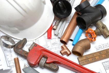 Plumbing parts, tools, and plans used by LYF Services.